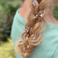 Close-up of blonde braid with Pixie Paste Friday Night Lights hair glitter and tiny football shapes, non-toxic sparkle gel for game day. Football Hair Glitter